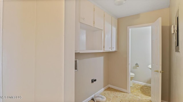 clothes washing area featuring laundry area, hookup for a washing machine, and baseboards