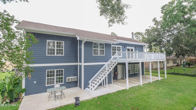 rear view of house with a wooden deck, a lawn, and a patio