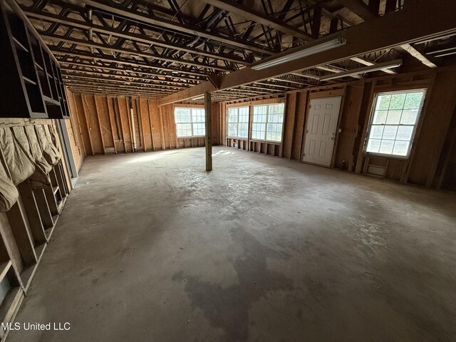 miscellaneous room with unfinished concrete floors