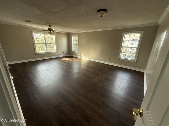 unfurnished room with dark hardwood / wood-style flooring, ceiling fan, ornamental molding, and a textured ceiling