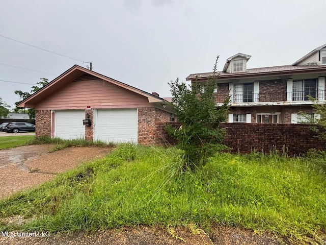 4805 Washington Ave, Gulfport, MS 39507 - view of property exterior featuring brick siding and concrete driveway