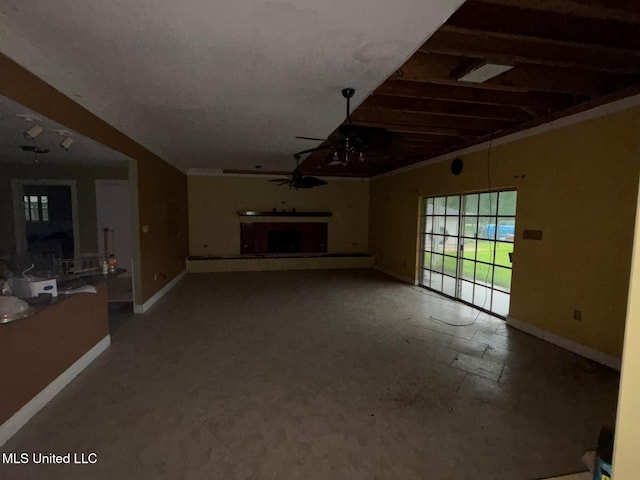 4805 Washington Ave, Gulfport, MS 39507 - unfurnished living room featuring ceiling fan and a fireplace with raised hearth