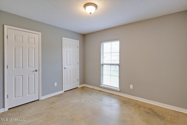 unfurnished bedroom featuring baseboards
