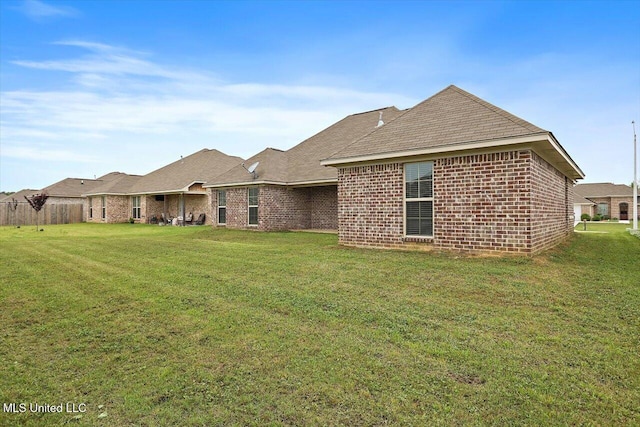 back of house with brick siding