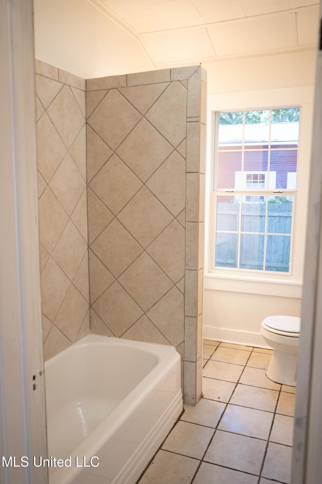 full bathroom featuring tile patterned flooring and toilet