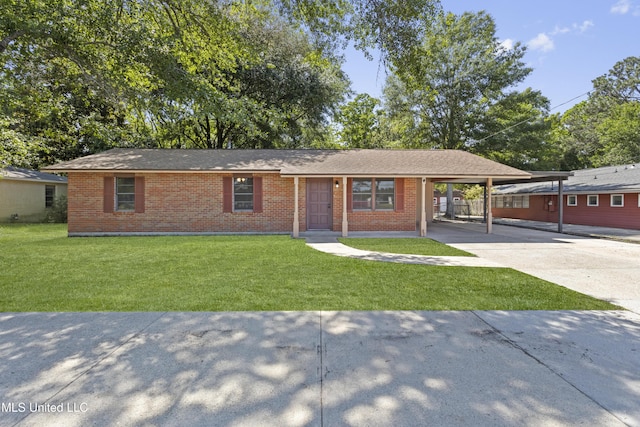 449 Klondyke Rd, Long Beach, MS 39560 - ranch-style home with brick siding, driveway, a front yard, and a carport