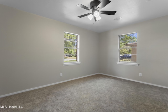 449 Klondyke Rd, Long Beach, MS 39560 - carpeted spare room featuring baseboards, a healthy amount of sunlight, and ceiling fan