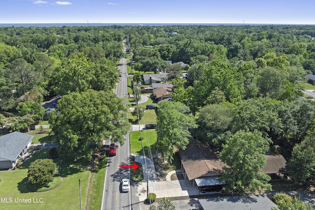 449 Klondyke Rd, Long Beach, MS 39560 - bird's eye view featuring a wooded view