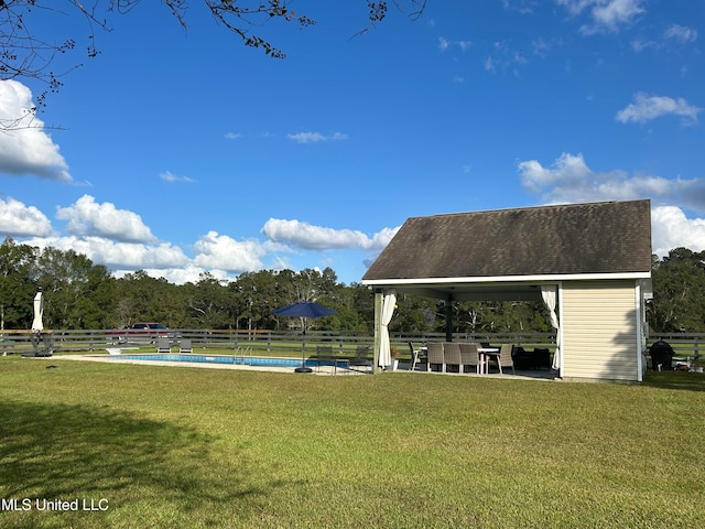 view of home's community featuring a swimming pool, a yard, and a gazebo