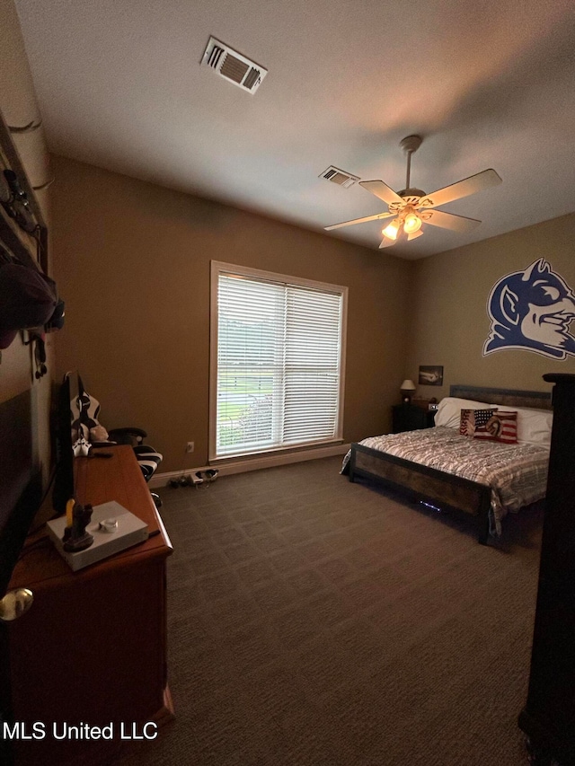 bedroom with dark carpet and ceiling fan