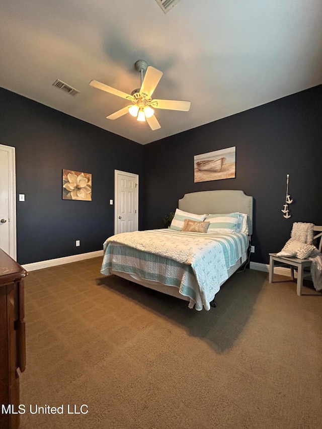 bedroom with ceiling fan and dark carpet