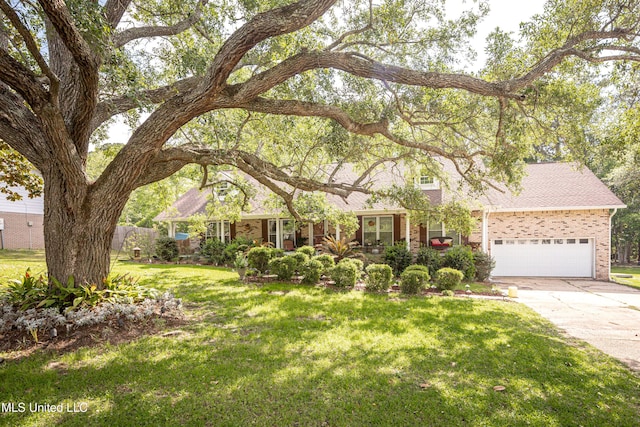 1344 Diller Rd, Ocean Springs, MS 39564 - view of front of house featuring brick siding, concrete driveway, and a garage