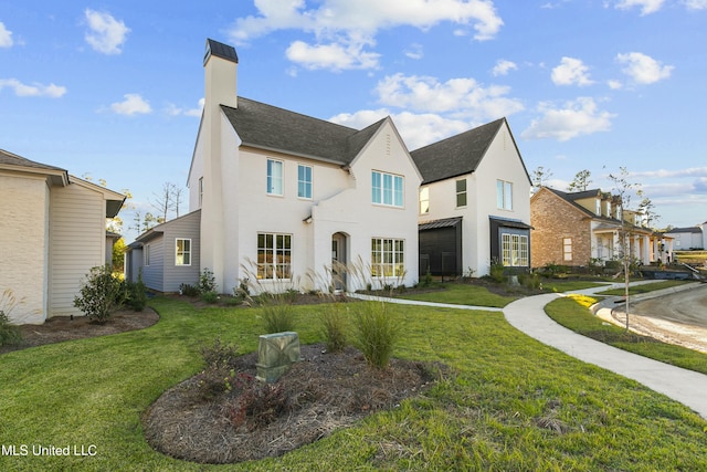 view of front of property with a front lawn