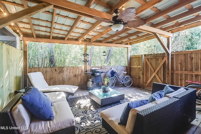 view of patio with an outdoor living space and ceiling fan