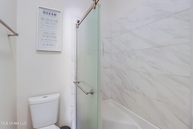 bathroom with an enclosed shower and toilet