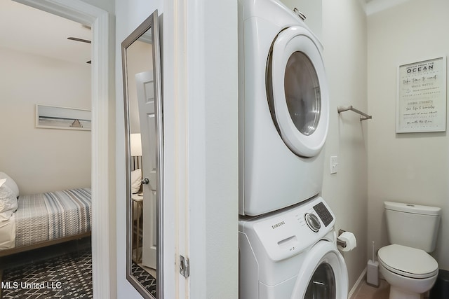 laundry room featuring stacked washer and dryer