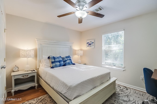 bedroom featuring dark wood-type flooring and ceiling fan