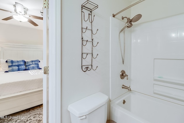 bathroom with ceiling fan, toilet, and shower / bathing tub combination