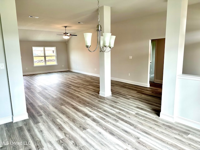 interior space with ceiling fan with notable chandelier, light wood-type flooring, and vaulted ceiling