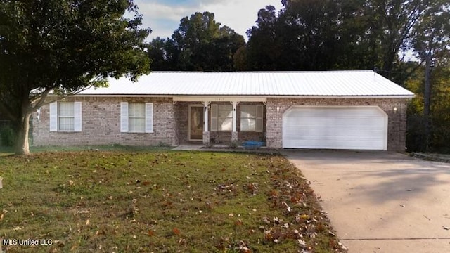 single story home featuring a front yard and a garage