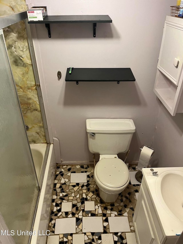 full bathroom with vanity, toilet, enclosed tub / shower combo, and tile patterned flooring