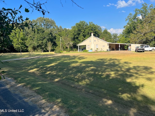 view of yard with a carport