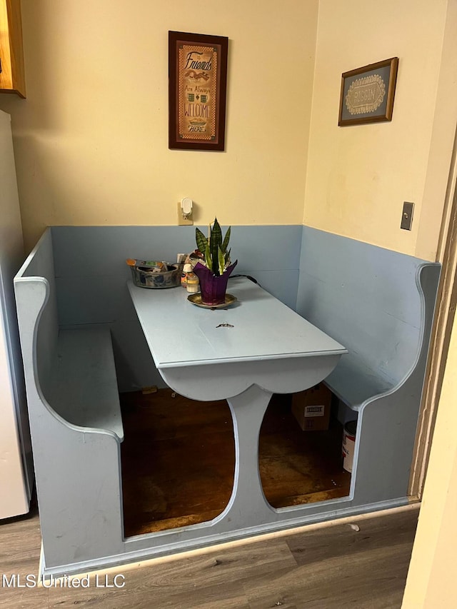 dining area with hardwood / wood-style floors