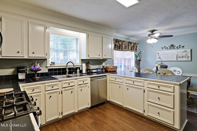 206 Southwind Dr, Richland, MS 39218 - kitchen featuring dishwasher, a sink, a peninsula, black gas stove, and tile countertops