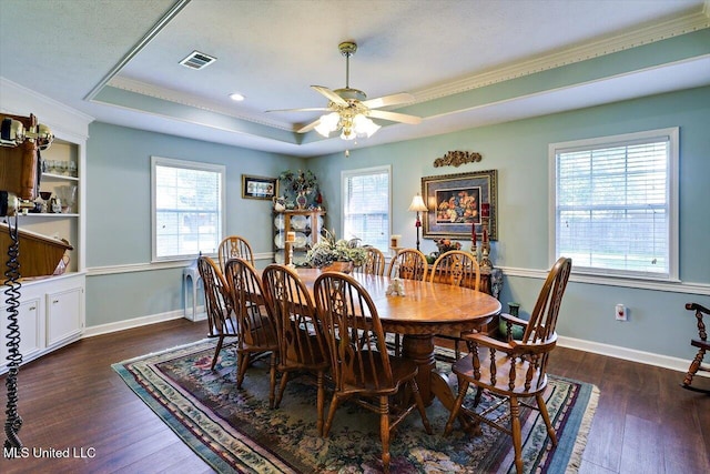 206 Southwind Dr, Richland, MS 39218 - dining area featuring a raised ceiling, ornamental molding, ceiling fan, wood-type flooring, and baseboards