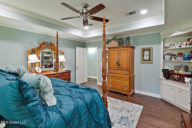 206 Southwind Dr, Richland, MS 39218 - bedroom featuring a tray ceiling, dark wood-style flooring, crown molding, baseboards, and a ceiling fan
