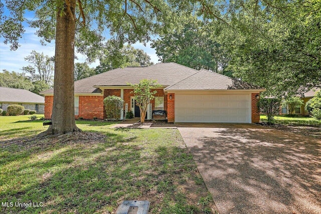 206 Southwind Dr, Richland, MS 39218 - single story home with a garage, concrete driveway, a front yard, and brick siding