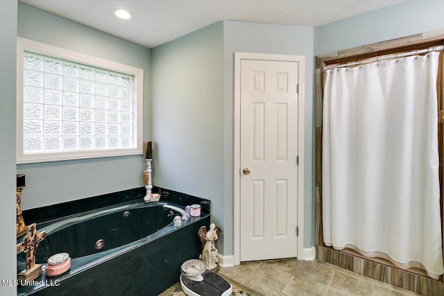206 Southwind Dr, Richland, MS 39218 - bathroom with a whirlpool tub, curtained shower, tile patterned flooring, and recessed lighting