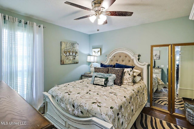 206 Southwind Dr, Richland, MS 39218 - bedroom featuring multiple windows, wood finished floors, and a ceiling fan