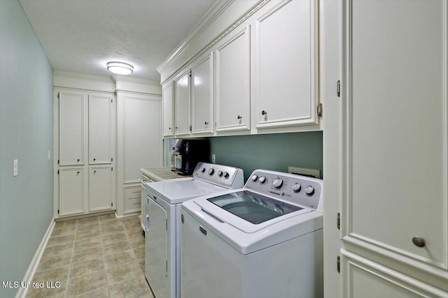 206 Southwind Dr, Richland, MS 39218 - washroom with cabinet space, washer and clothes dryer, a textured ceiling, and baseboards