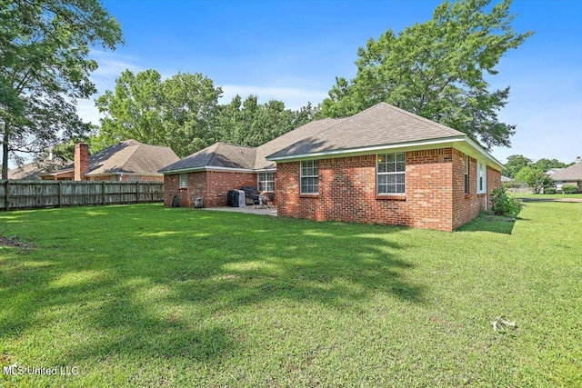 206 Southwind Dr, Richland, MS 39218 - back of property with brick siding, a shingled roof, and a patio area