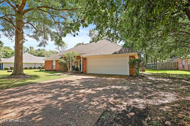 206 Southwind Dr, Richland, MS 39218 - ranch-style house featuring concrete driveway, an attached garage, roof with shingles, and brick siding