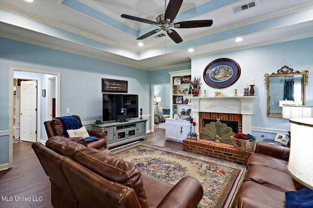 206 Southwind Dr, Richland, MS 39218 - living room with dark wood-style floors, a ceiling fan, crown molding, a fireplace, and baseboards