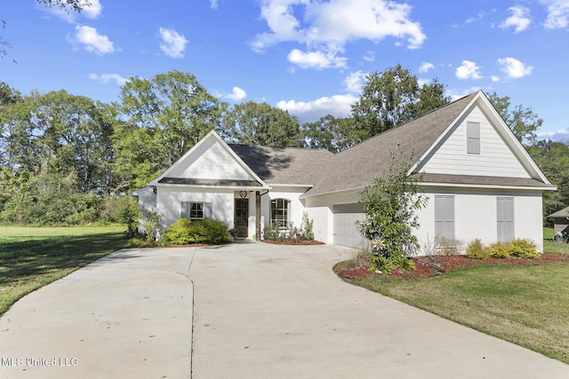 view of front of house with a garage and a front lawn