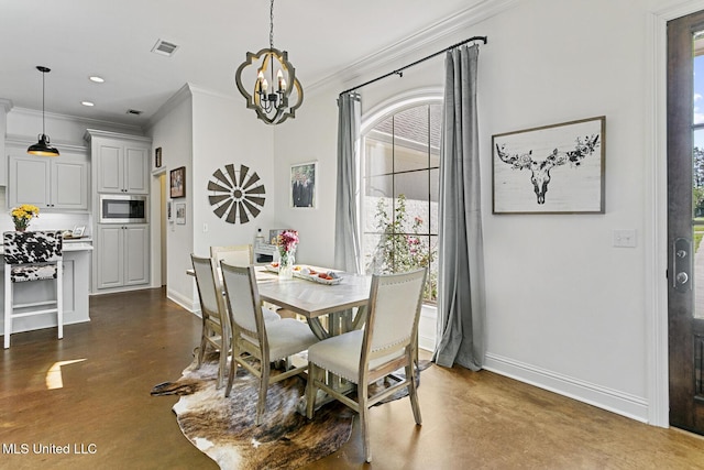 dining space with crown molding and a chandelier