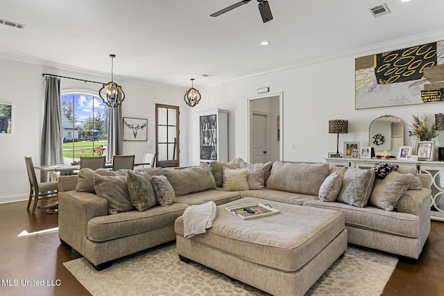 living room featuring crown molding, ceiling fan with notable chandelier, and hardwood / wood-style floors