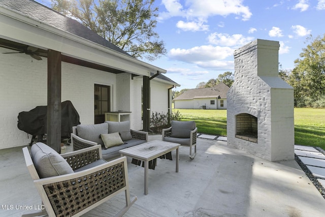 view of patio featuring ceiling fan, grilling area, and an outdoor living space with a fireplace