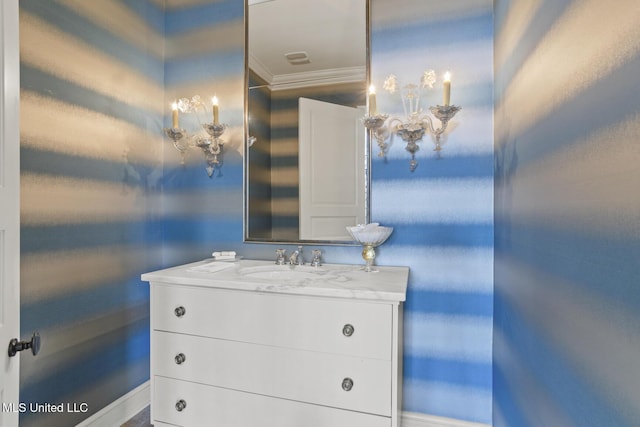 bathroom with vanity and crown molding