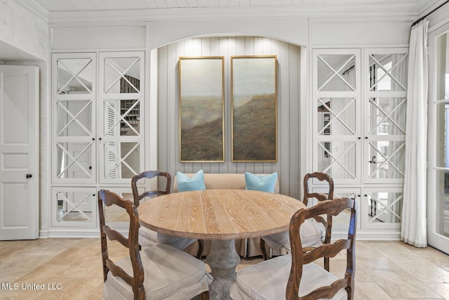 dining area with crown molding