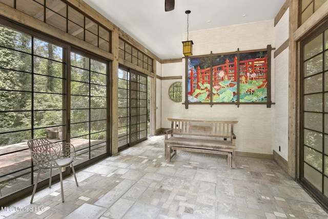 unfurnished sunroom featuring a healthy amount of sunlight