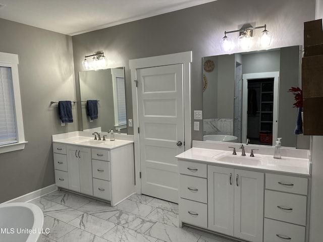 bathroom with vanity and a tub