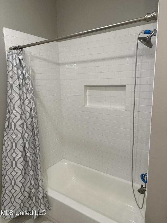 bathroom featuring shower / bath combination with curtain