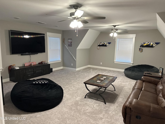 carpeted living room with vaulted ceiling