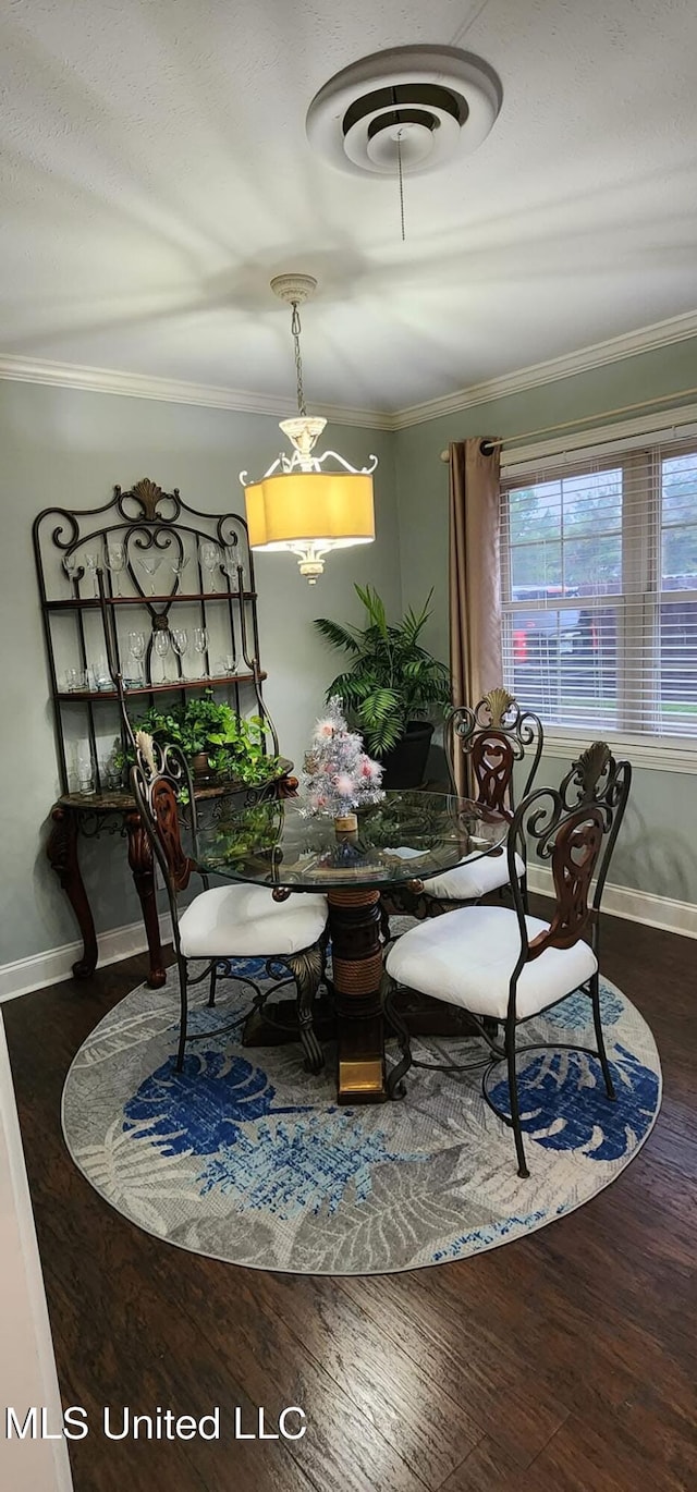 210 Jefferson Davis Blvd, Natchez, MS 39120 - dining area with ornamental molding, baseboards, and wood finished floors