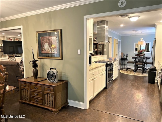 210 Jefferson Davis Blvd, Natchez, MS 39120 - kitchen with stainless steel gas range, ornamental molding, wall chimney exhaust hood, dark wood-style floors, and baseboards