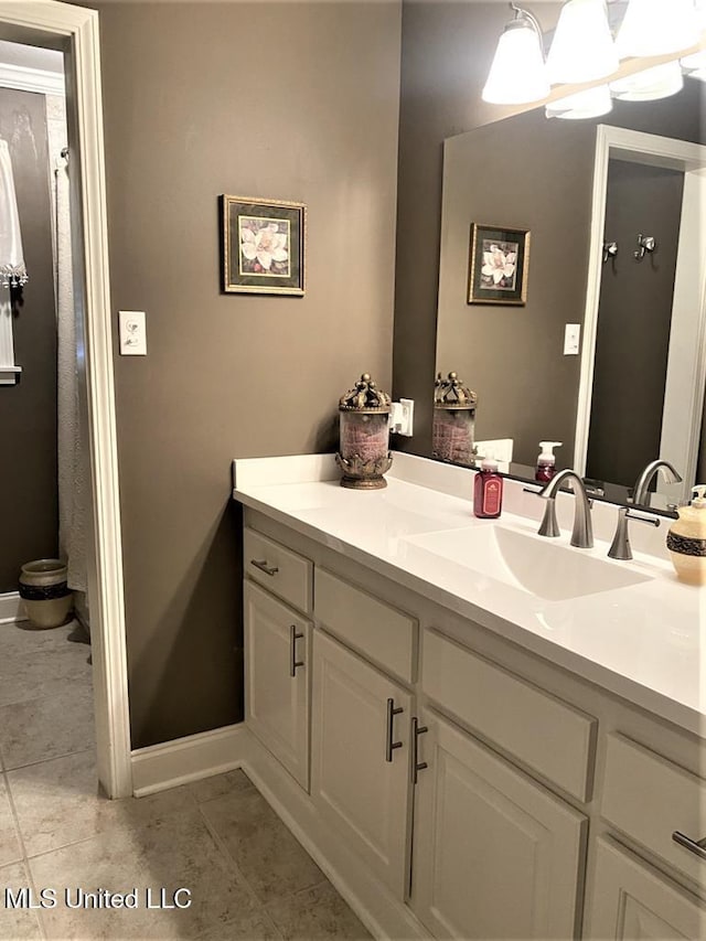 210 Jefferson Davis Blvd, Natchez, MS 39120 - bathroom with vanity, baseboards, and tile patterned flooring
